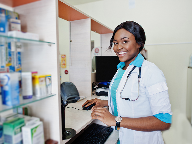 African american pharmacist working in drugstore at hospital pharmacy. African healthcare.